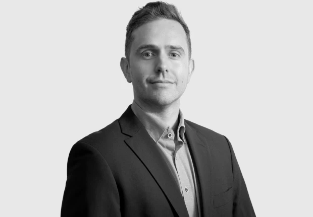 A headshot image of Jason Forrest