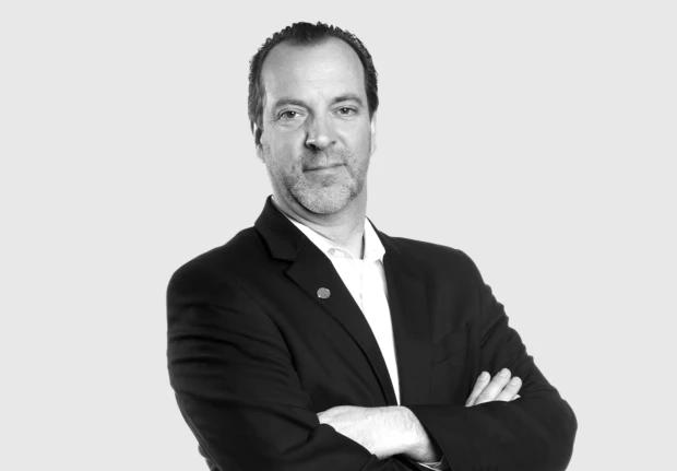 A headshot image of Derek White