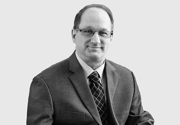 A headshot image of David Riedl