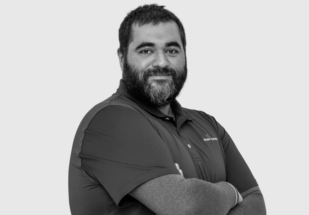 A headshot image of Amir Issazadeh