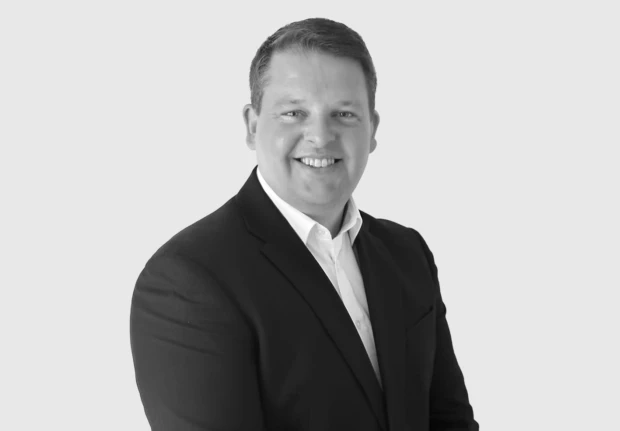 A headshot image of Andrew Cowan