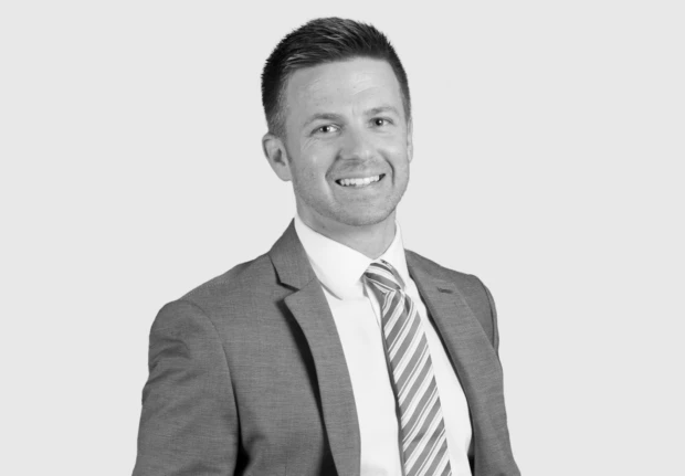 A headshot image of Andrew Miller