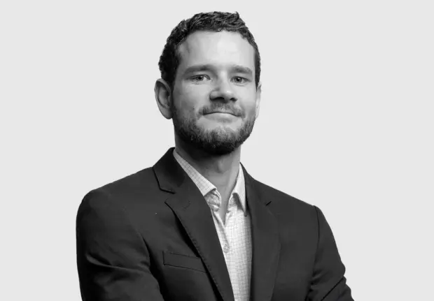 A headshot image of Aidan Hopkins