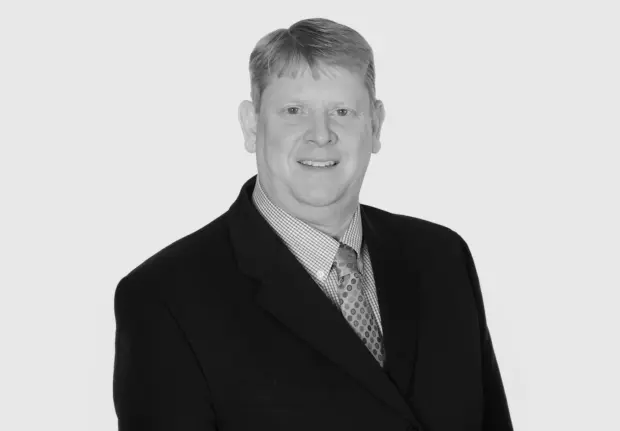 A headshot image of Kirt Sasser