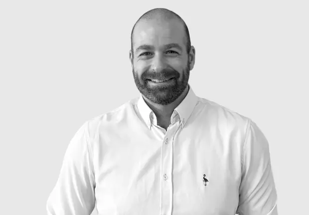 A headshot image of Derek Real Duval