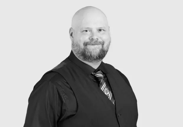 A headshot image of Travis Nelson