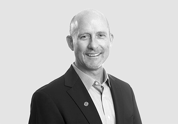 A headshot image of Kevin Lewis