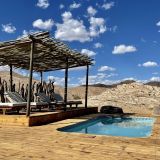 L swimming pool and lounge deck