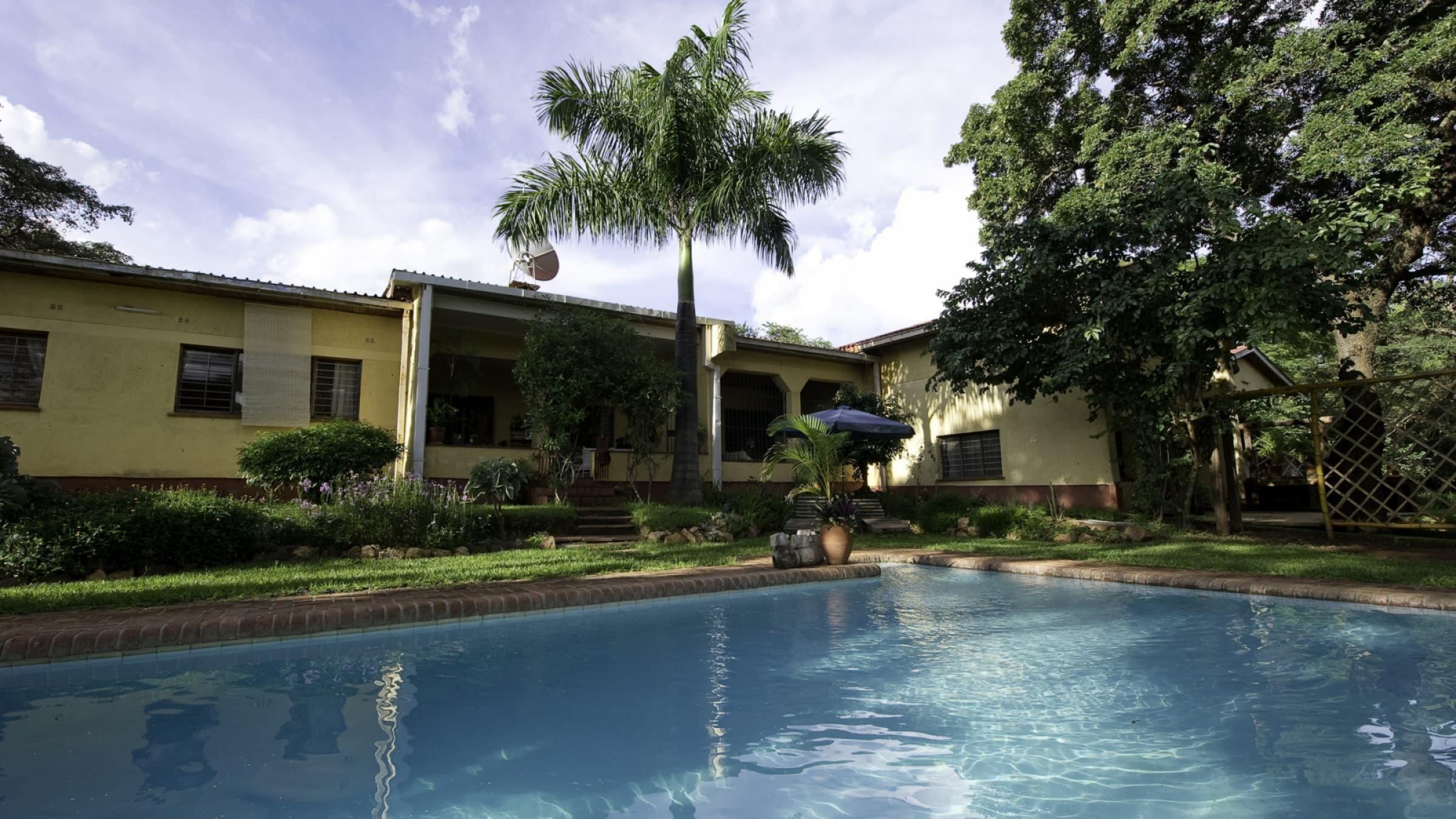 H Heuglins Lodge Swimming Pool And Exterior View