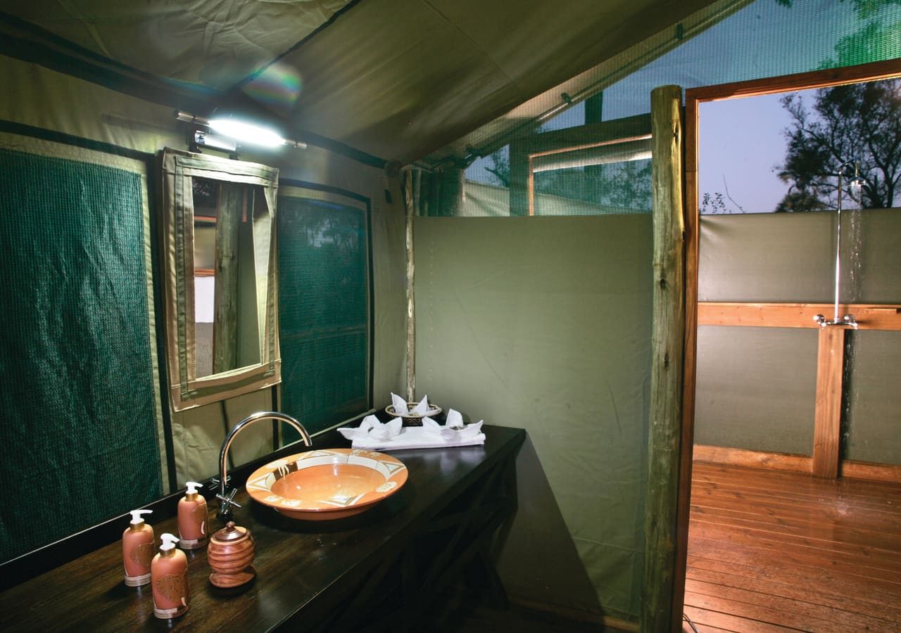 Moremi crossing tented bathroom with outdoor shower 1280