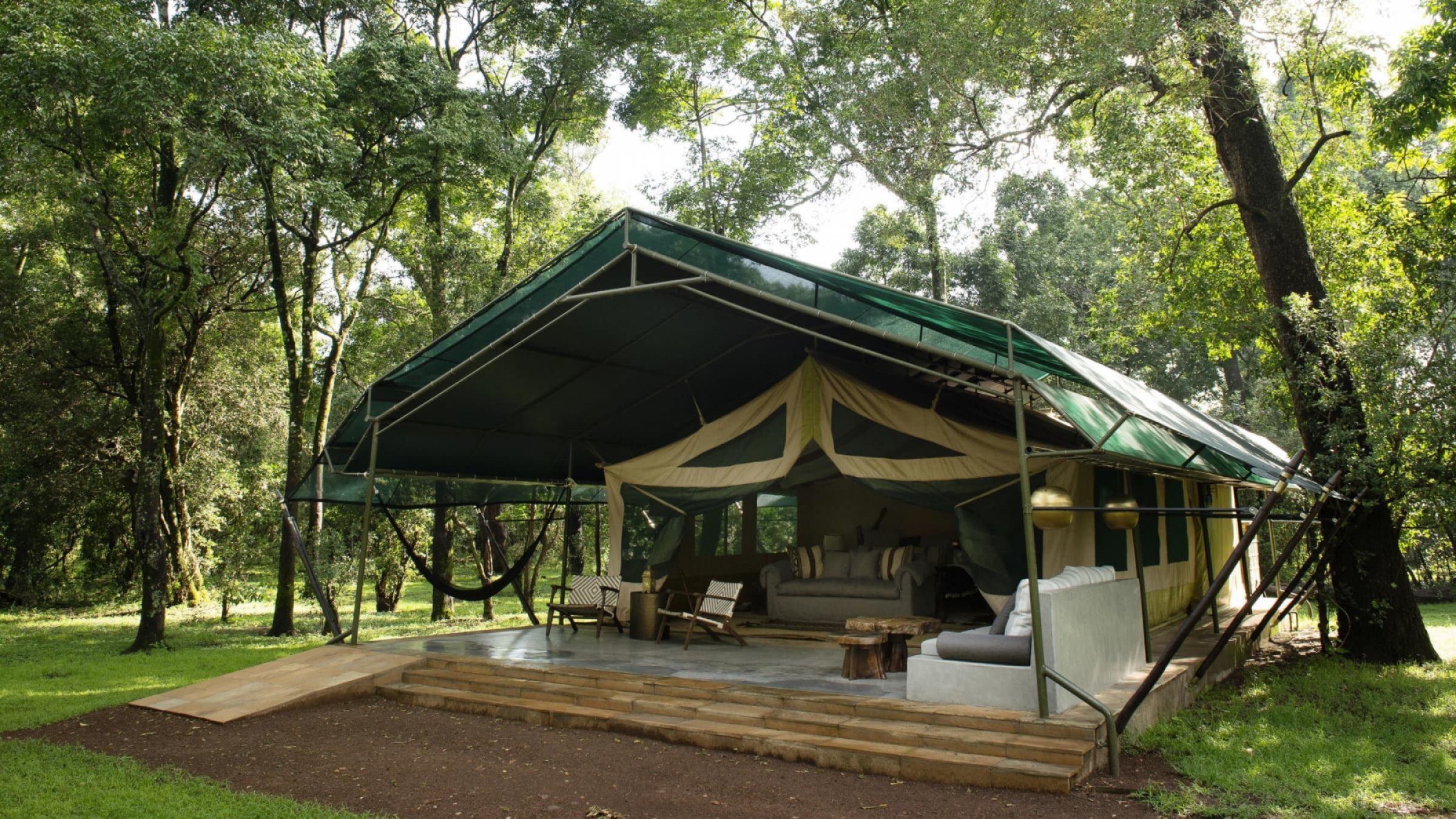 Il moran camp tent exterior set amongst the trees 2400