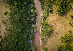 Sanctuary olonana camp aerial view of lodges by the river 1280