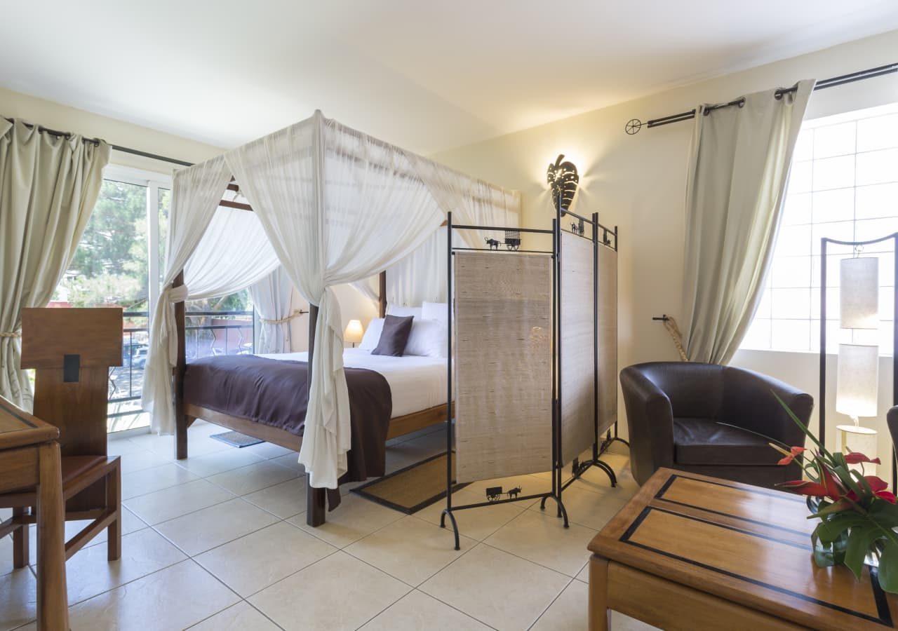 Relais des plateaux guest bedroom with a lounge 1280