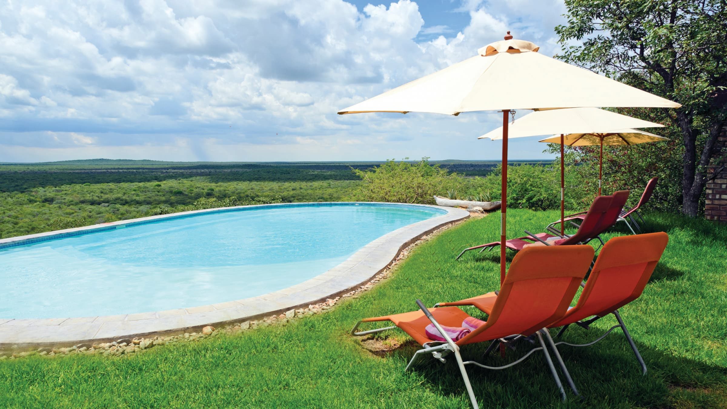 Etosha safari lodge pool and garden lounge area 2400