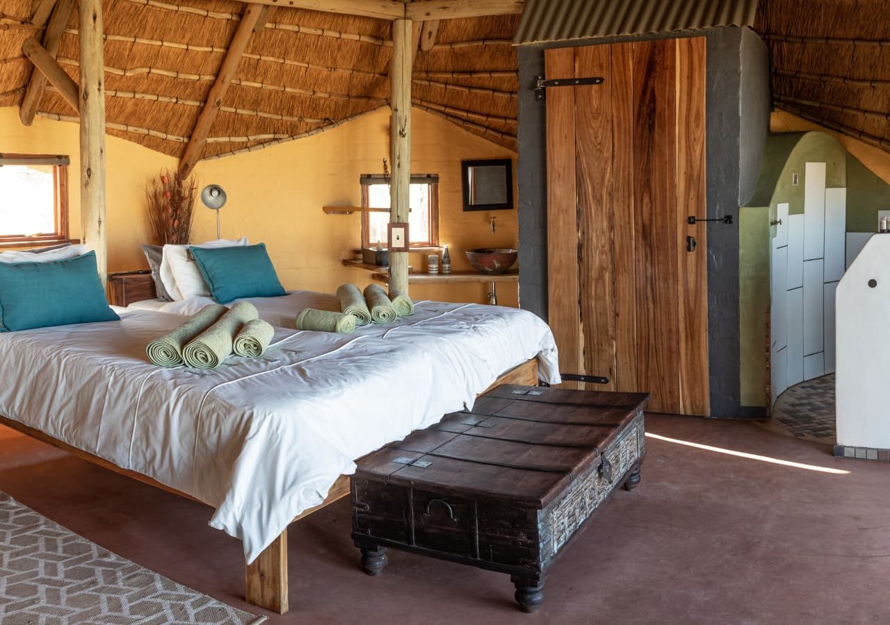 Kalahari red dunes lodge guest bedroom and ensuite 1280