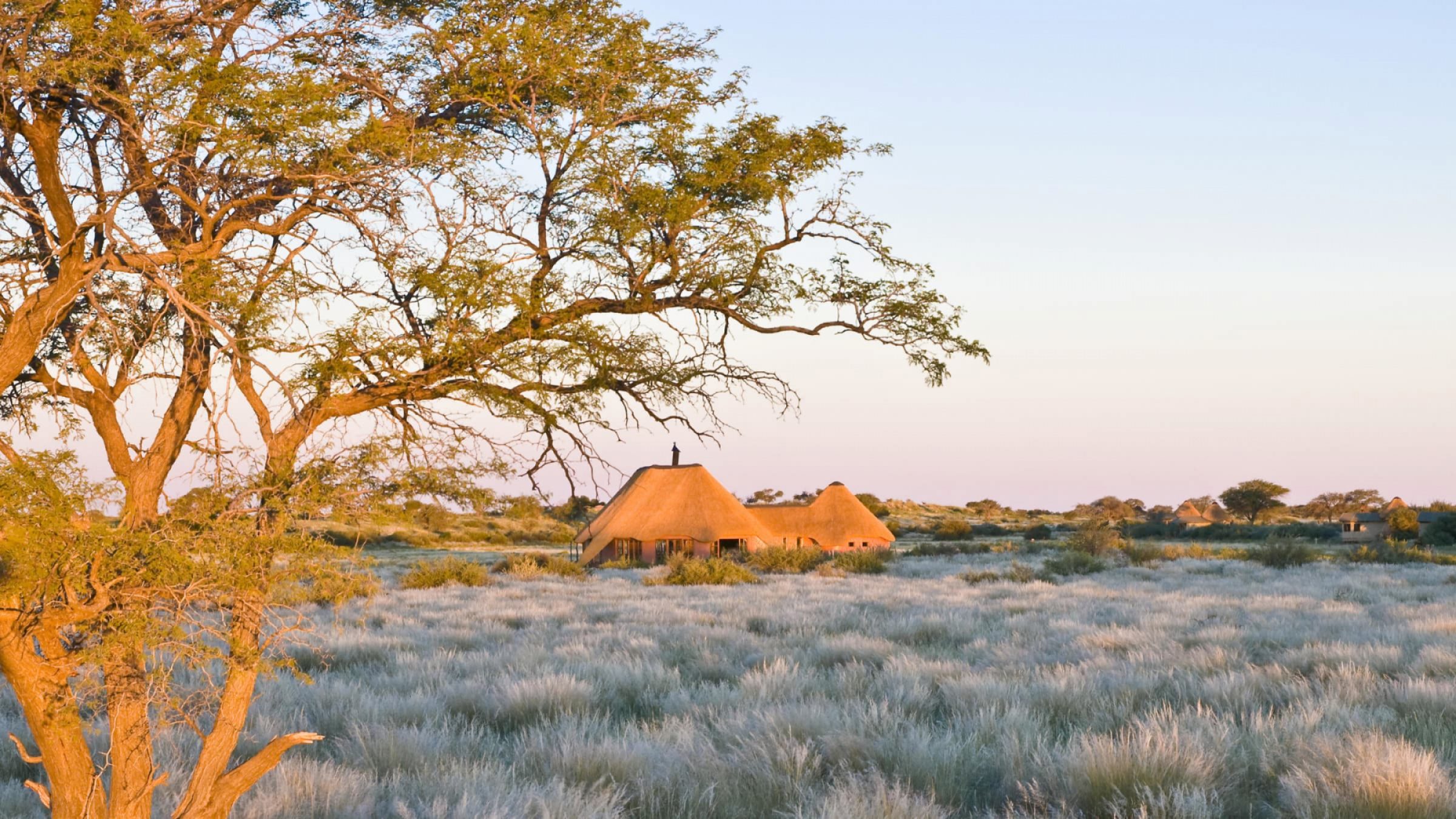 Kalahari red dunes lodge exterior of lodge in the sunset 2400