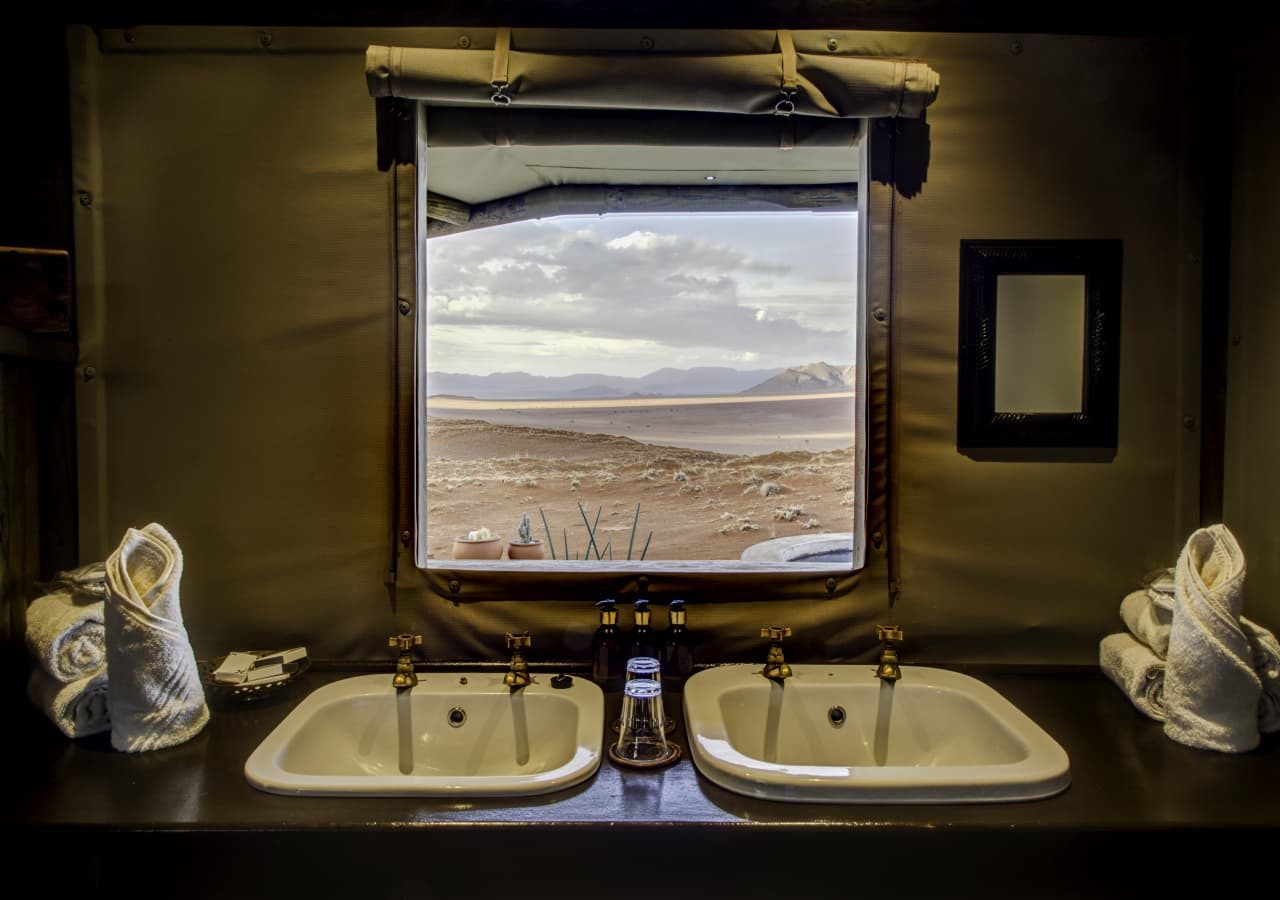 Wolwedans desert lodge tented bathroom with a view 1280