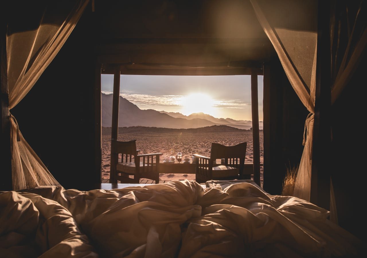 Wolwedans dune camp camp sunrise from bed 1280