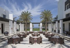 The chedi muscat outside dining in the courtyard 1280