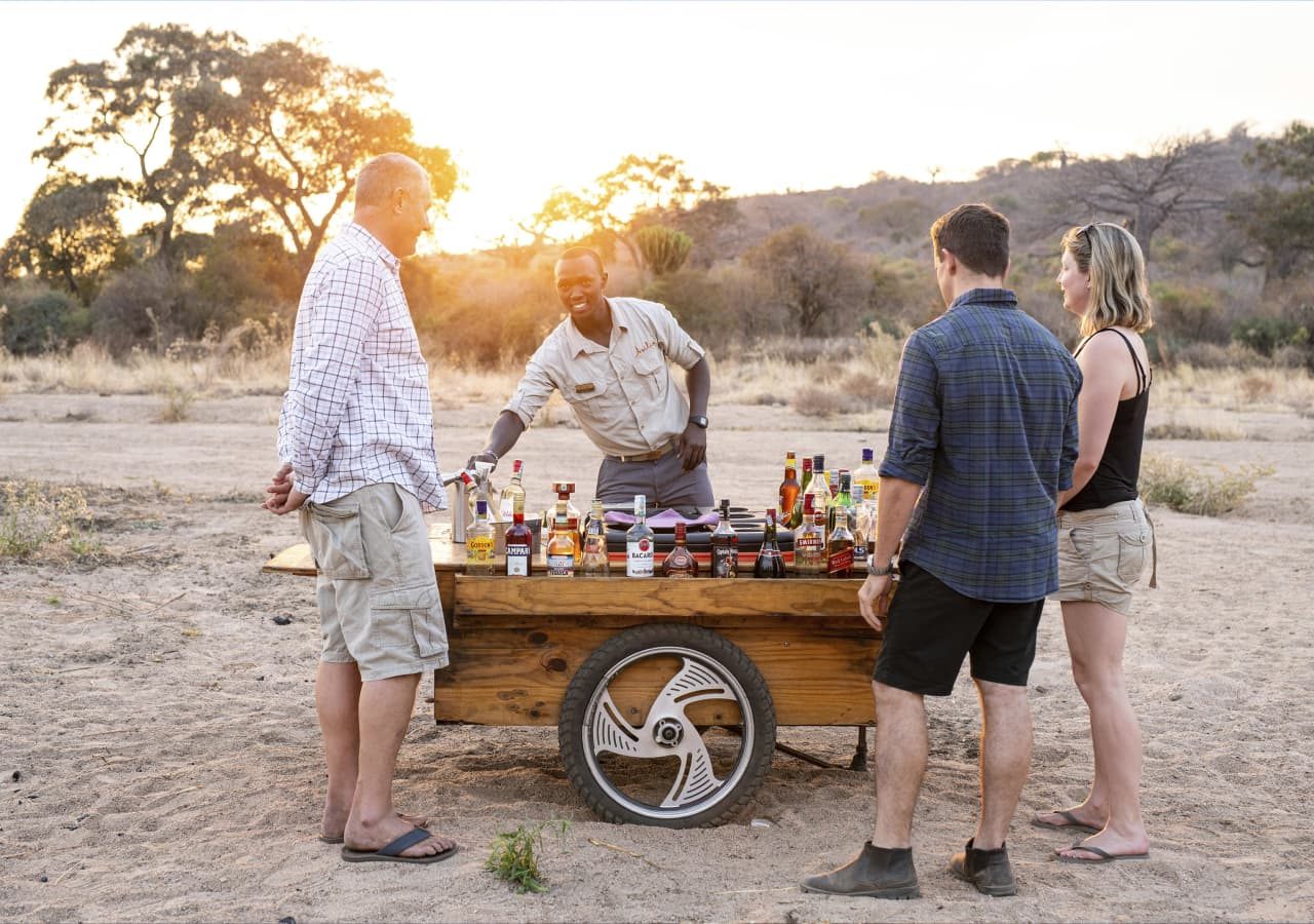 Asilia kwihala camp sundowners in the bush 1280