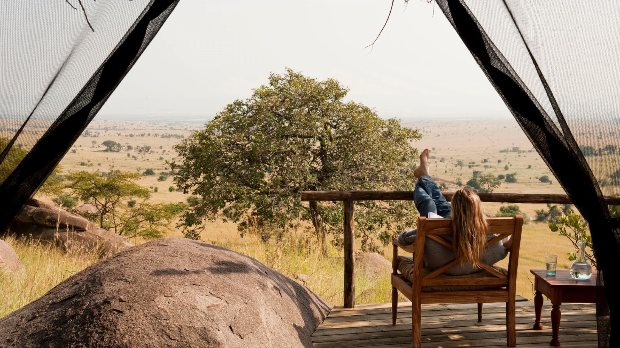 Lamai serengeti reading a book on the private deck 2400