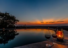 Mihingo lodge wine by the pool at sunset 1280