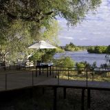 Toka leya camp guest deck area with views across the water 1280