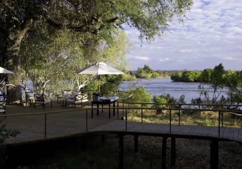 Toka leya camp guest deck area with views across the water 1280