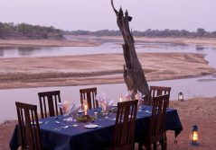 Nsefu camp dining on the riverbank 1280