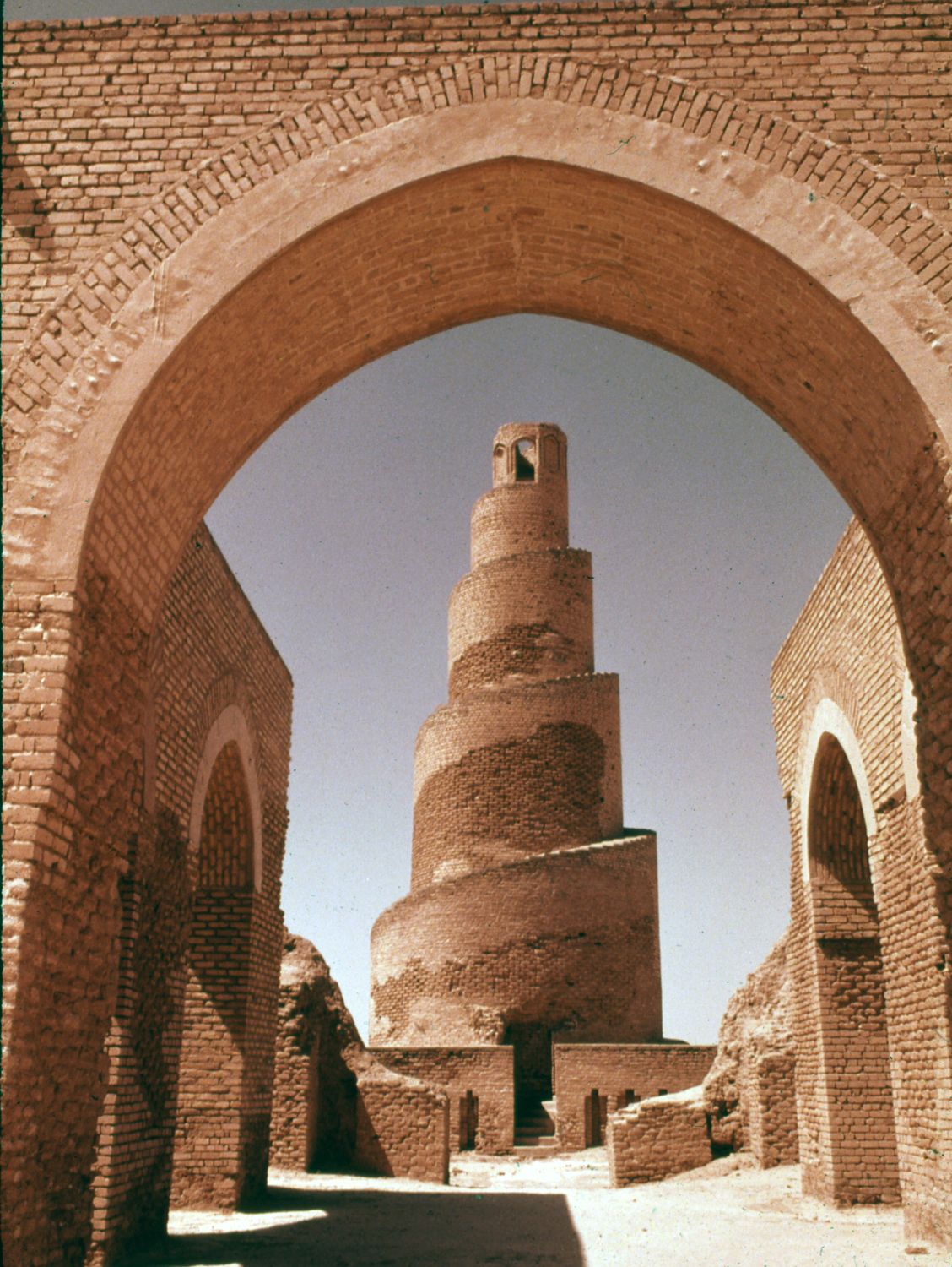 Jami' Abi Dulaf | View of spiral minaret from within the mosque arcades