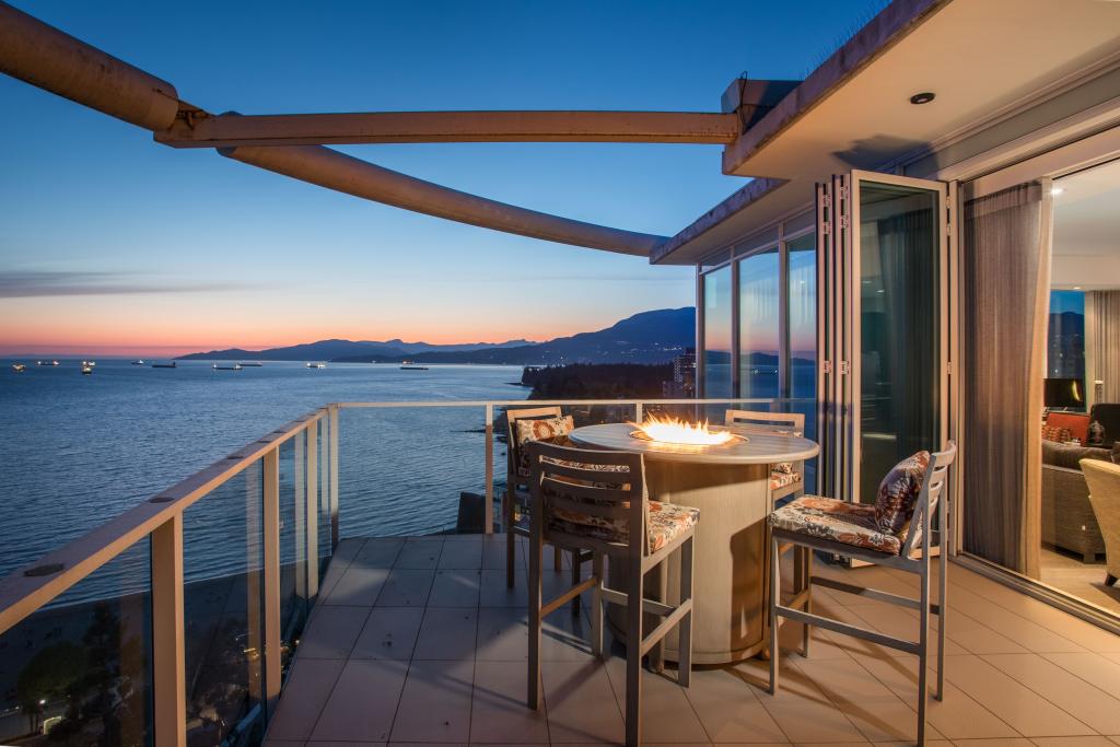 Stunning balcony view with fire pit overlooking the water at 2101 1221 BIDWELL STREET, Vancouver.