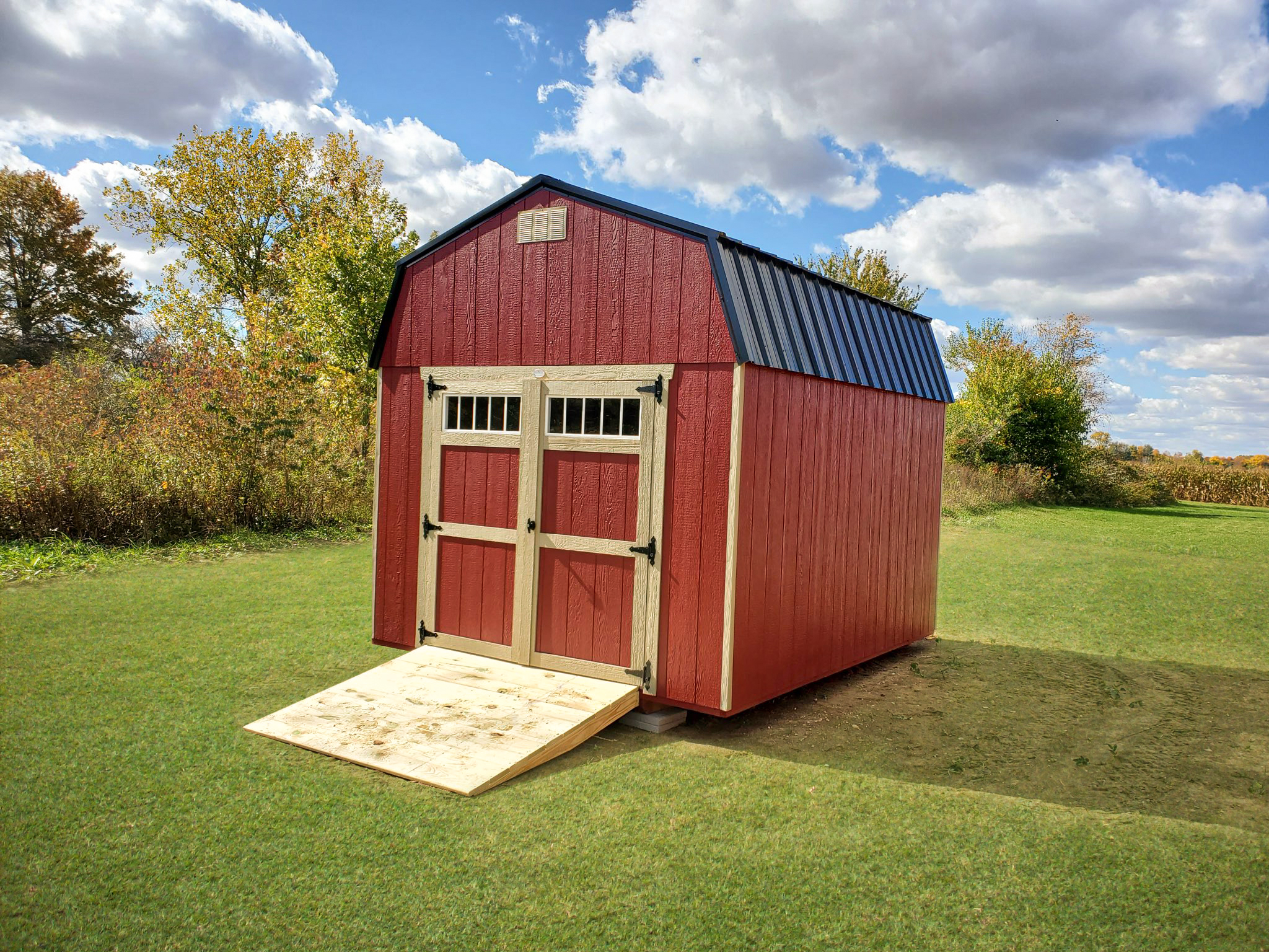 Red storage barn with ramp
