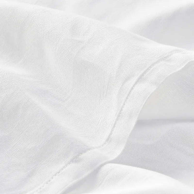 pillowcase pair in white — stitching and closure detail