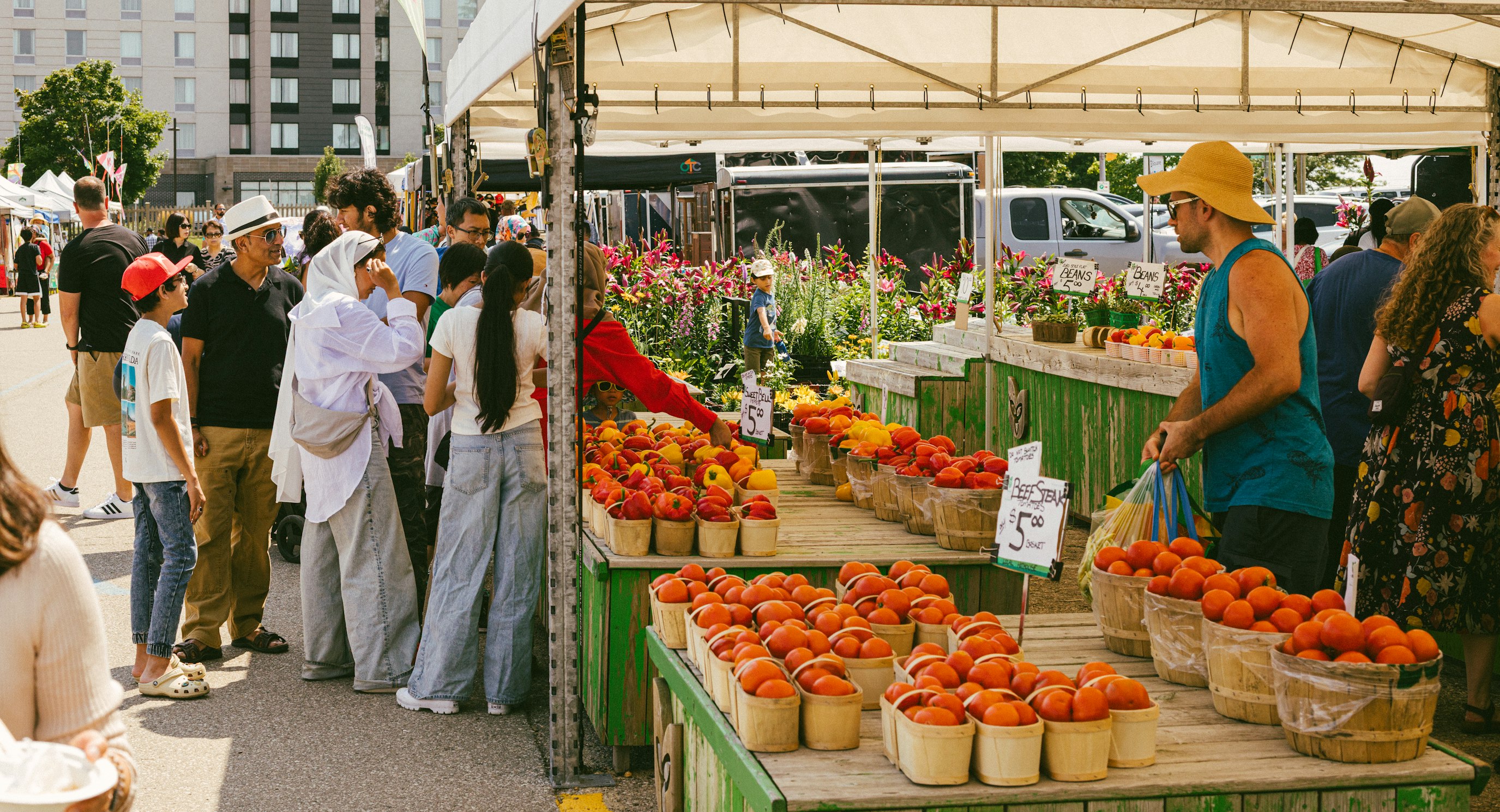 Vendor stalls with fresh produce at an outdoor market