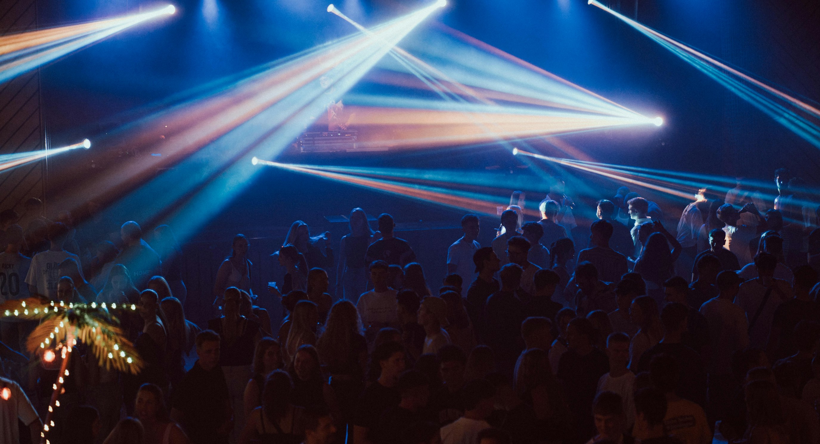 Concert crowd under stage lights