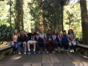 Pablo posing in a forest with his friends from the NSLI-YAcademic Year program.