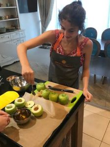 Catherine cooking with her host family