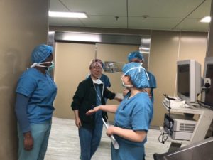 Tamia working with nurses and doctors at local hospital