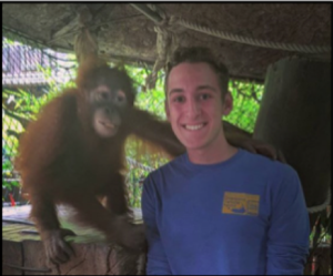 Sam with an orangutan