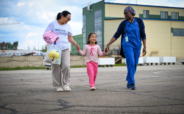 Buyandeleger walking to plane - FEH Mongolia Patient 2024