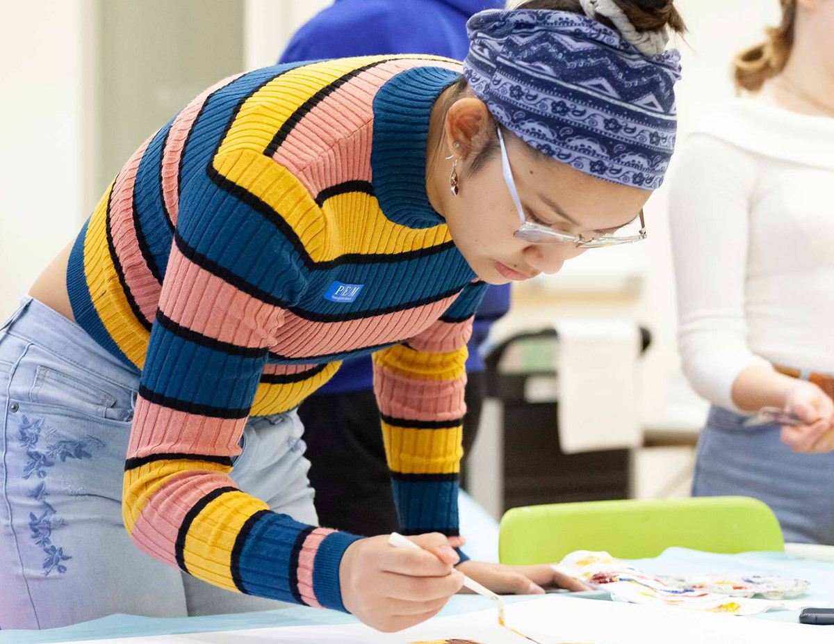 A student enjoys drop-in art making at PEM.