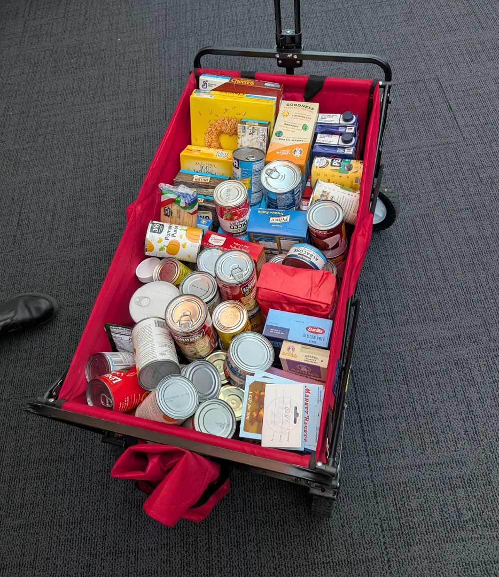 Wagon full of cans and boxes of donations