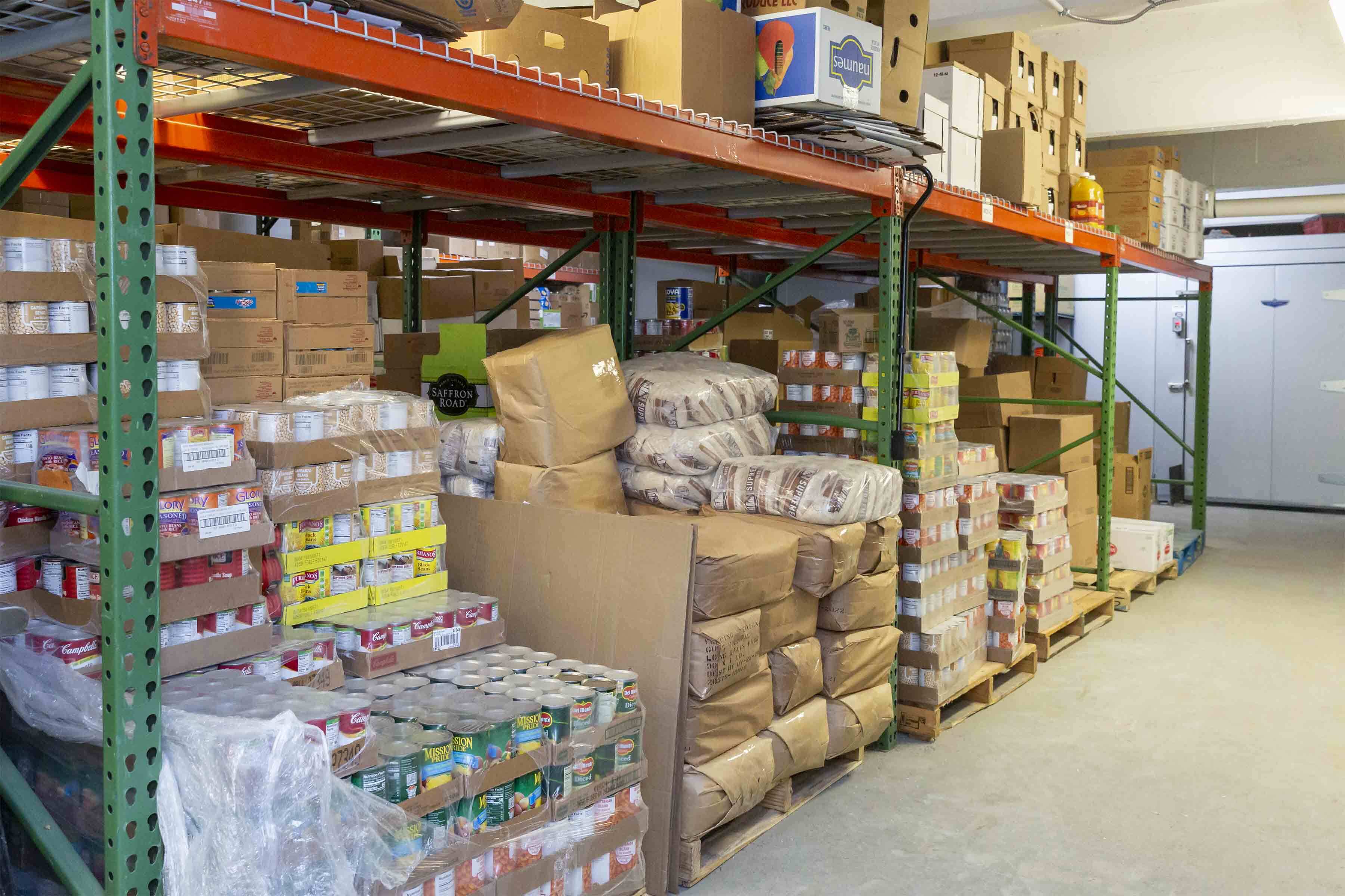 Shelves of cans and non perishable goods in the Salem Pantry's warehouse