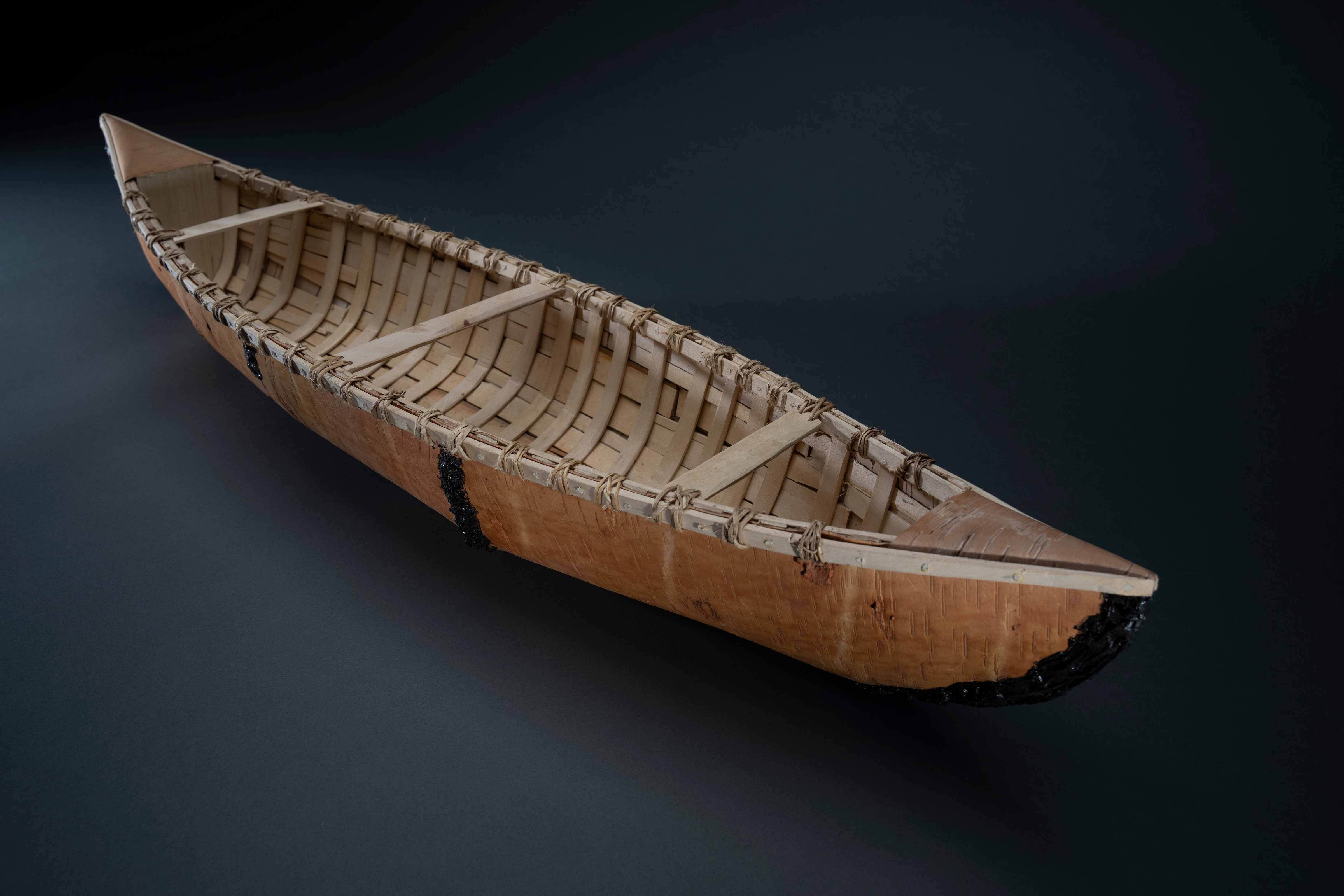 John Ferris (Constance Lake First Nation), Birchbark Canoe, 2022. Birchbark, rawhide, spruce root. On loan from the artist. Photo by James Kegley.