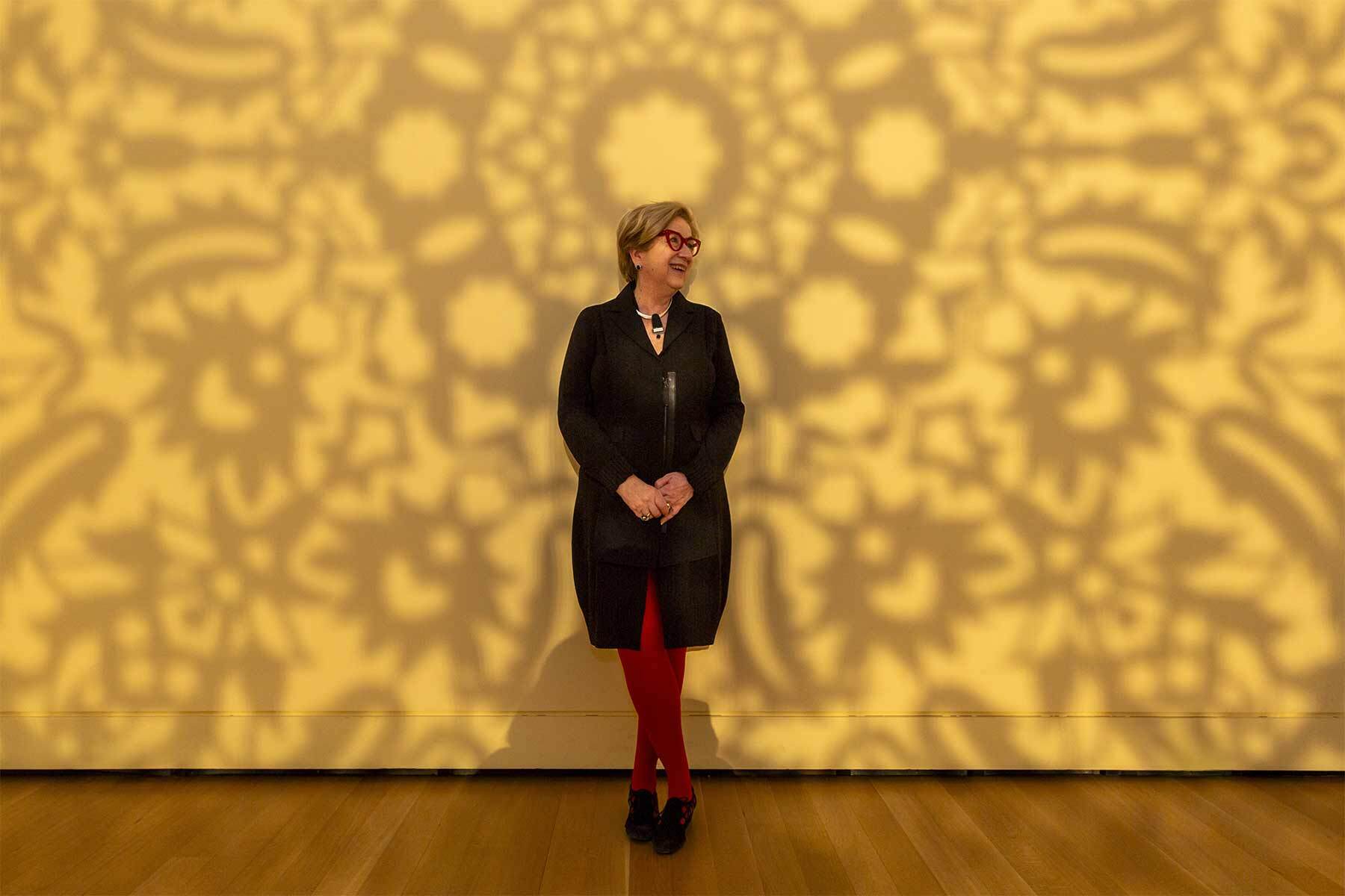 Lynda Roscoe Hartigan enjoying a moment in the Anila Quayyum Agha’s All the Flowers Are For Me. Photo by Kathy Tarantola/PEM.