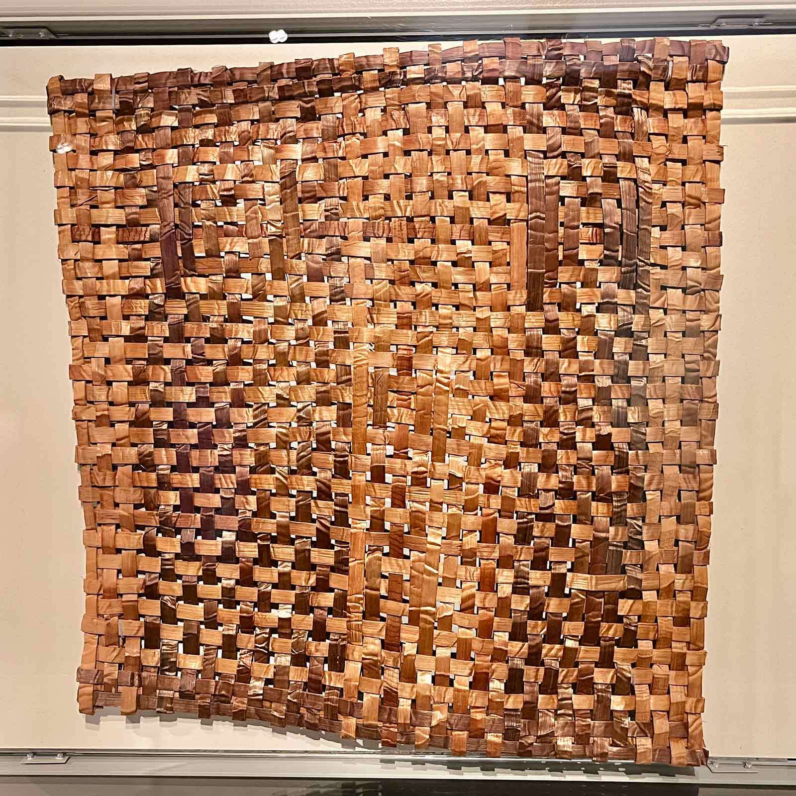A woven cedar bark mat