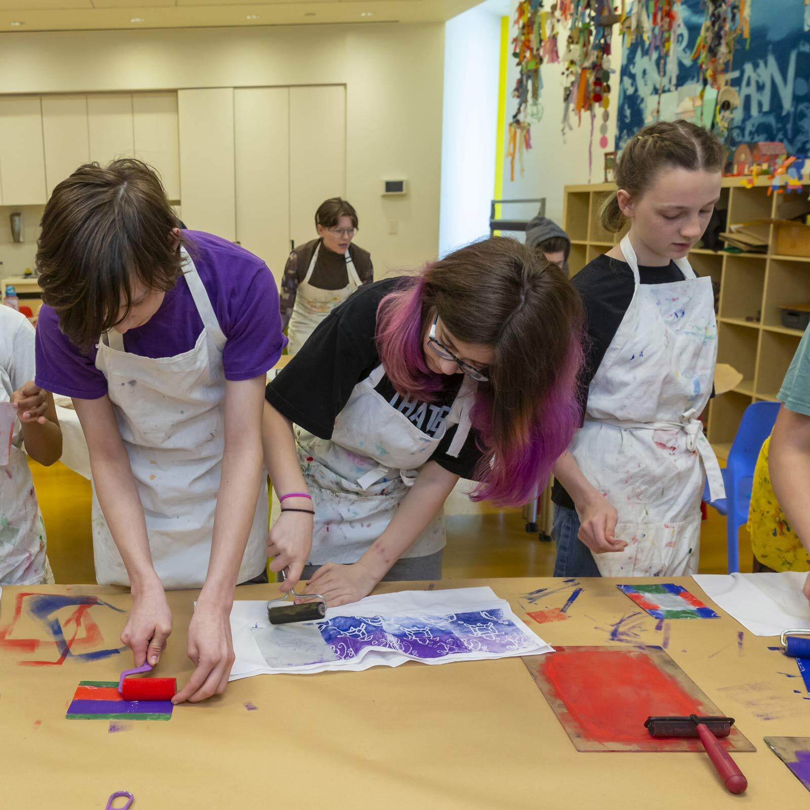 Kids participating in a craft during a Creative Kids week