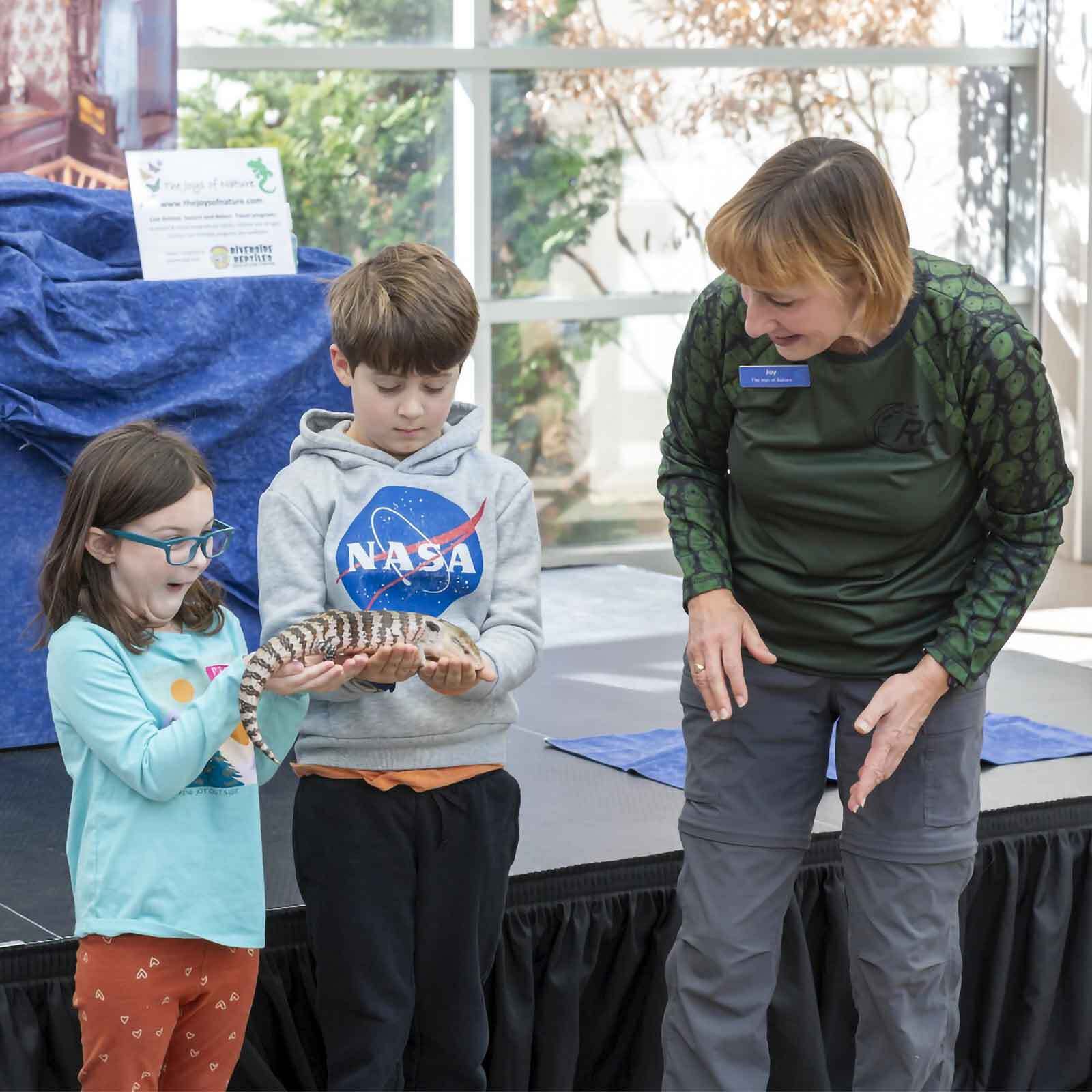Students interact with live animal demonstration
