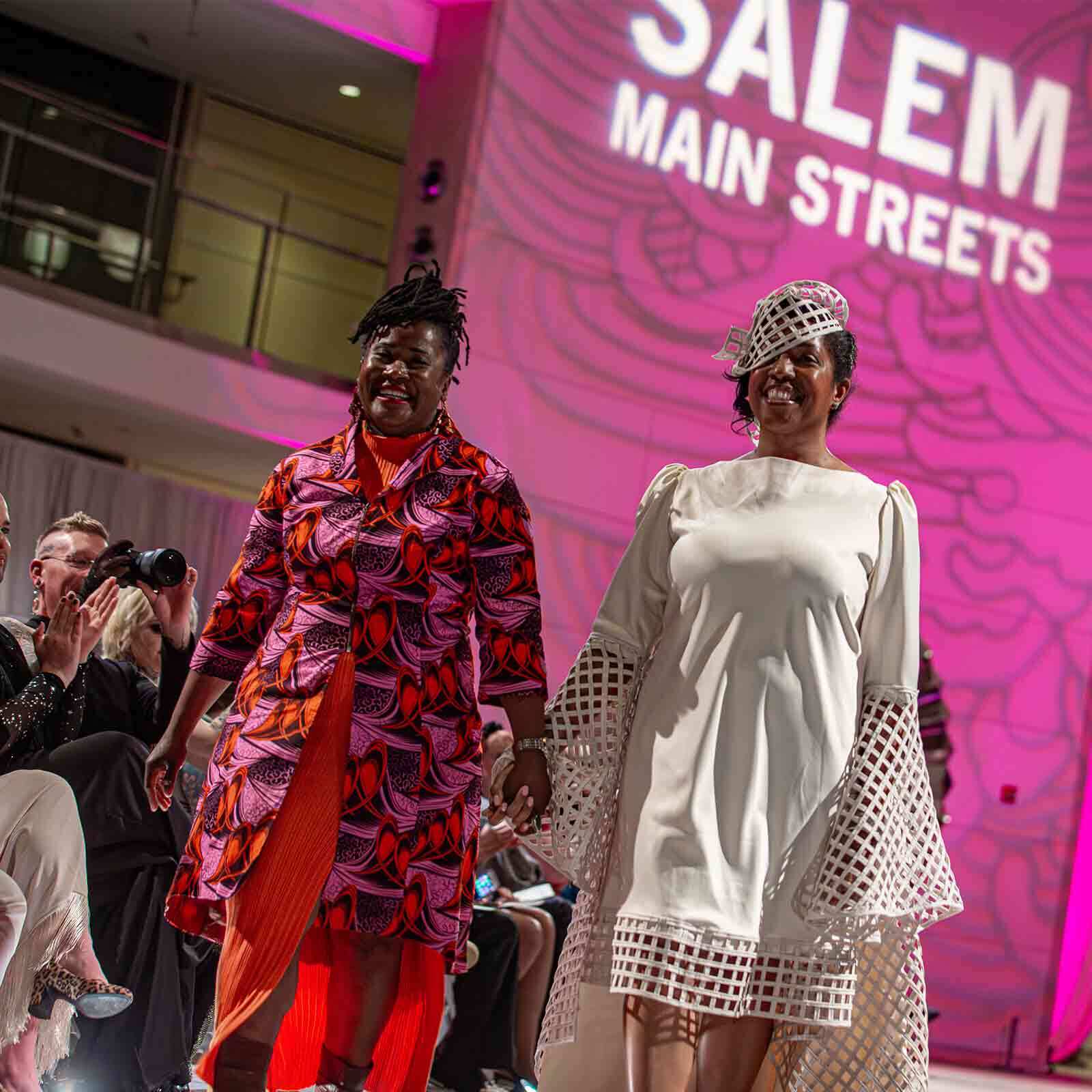 Models displaying fashion in the PEM atrium