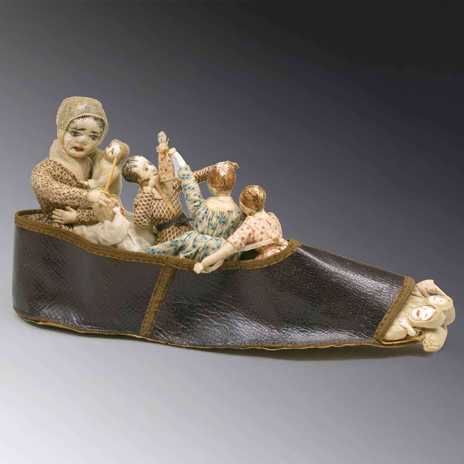 Sculpture of "There was an old lady who lived in a shoe"